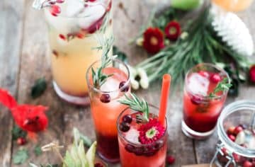Lots of festive cocktails sitting on a wood table