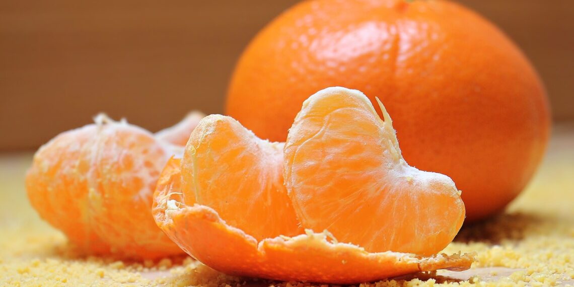 slices of tangerine and a whole tangerine