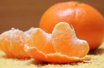 slices of tangerine and a whole tangerine